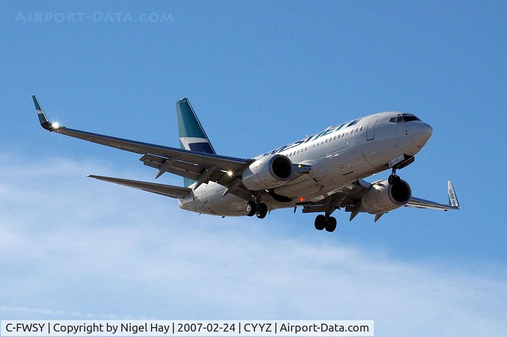 C-FWSY, 2004 Boeing 737-7CT C/N 32762, Landing on Rwy 05