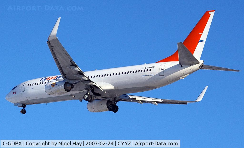 C-GDBX, 2003 Boeing 737-8Q8 C/N 33699, Job half done, tail re-paint. Landing on 06L
