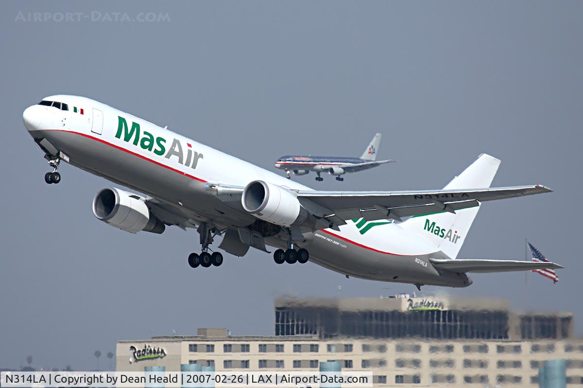 N314LA, 2001 Boeing 767-316F C/N 32573, Mas Air N314LA climbing out from RWY 25R, while an American Airlines 752 is on short-final to RWY 24R on the north complex.