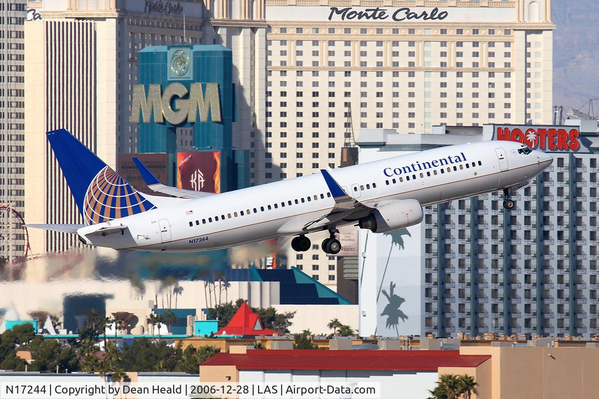 N17244, 1999 Boeing 737-824 C/N 28954, Continental Airlines N17244 (FLT COA396) climbing out from RWY 01R, passing in front of the Monte Carlo Hotel & Casino, enroute to George Bush Intercontinental Houston (KIAH).