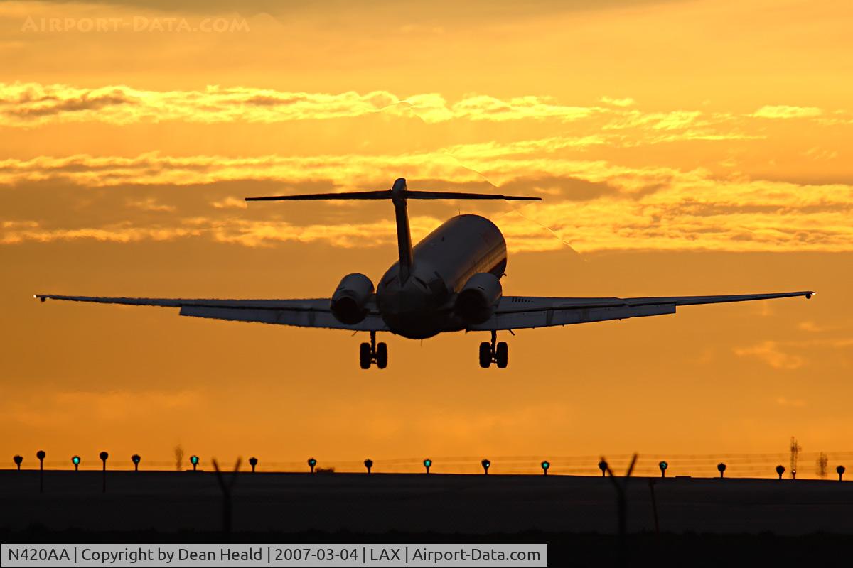 N420AA, 1986 McDonnell Douglas MD-82 (DC-9-82) C/N 49332, American Airlines N420AA (FLT AAL2459) from Dallas Fort Worth Int'l (KDFW) seconds from landing on RWY 24R. The vortices can be seen coming off the right flap edge and extending upward and to the left due to the sunlight, distorting the image in places.