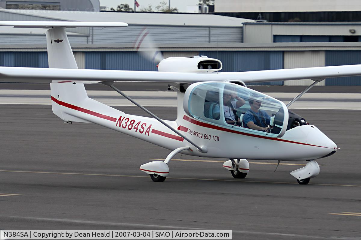 N384SA, 2000 Iniziative Industriali Italiane SKY ARROW 650TCN C/N CN006, 2000 Iniziative Industriali Italian SKY ARROW 650TCN N384SA taxiing back to parking after landing on RWY 21. The friendly lady in the back seat was nice enough to wave hello.