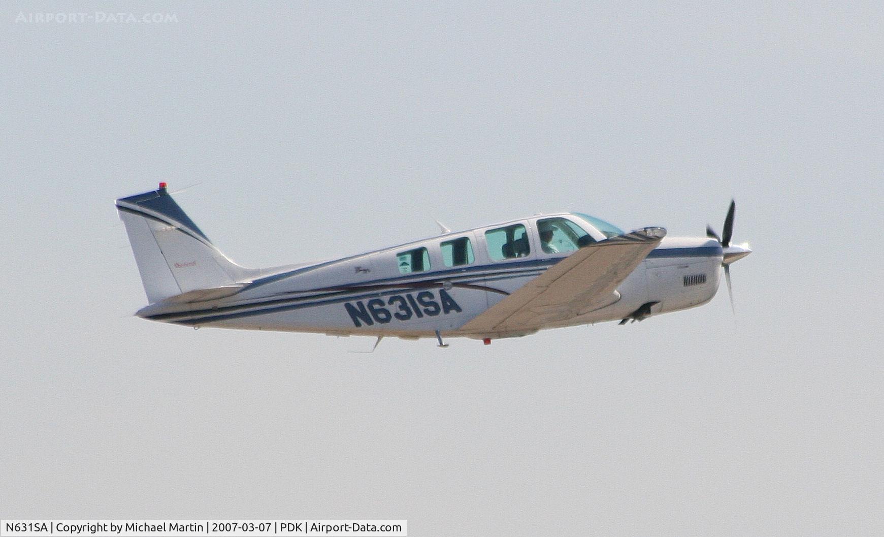 N631SA, 1999 Raytheon Aircraft Company A36 Bonanza C/N E-3231, Departing PDK enroute home