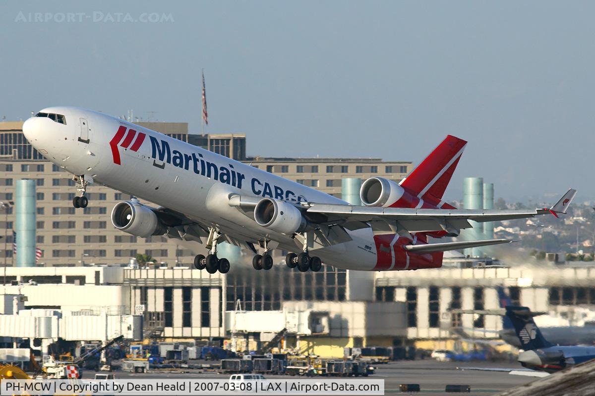 PH-MCW, 1998 McDonnell Douglas MD-11F C/N 48788, Martinair Holland PH-MCW (FLT MPH70) climbing out from RWY 25R enroute to Seattle Tacoma Int'l (KSEA) late in the day.