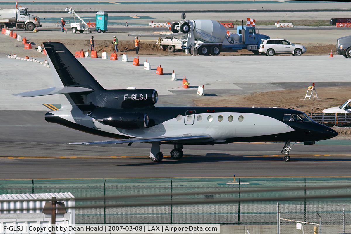 F-GLSJ, 1982 Dassault Falcon 50 C/N 107, Dassault Aviation's very uniquely painted Mystere Falcon 50 F-GLSJ turning onto taxiway Alpha from taxiway Sierra Tango after landing on RWY 25R.