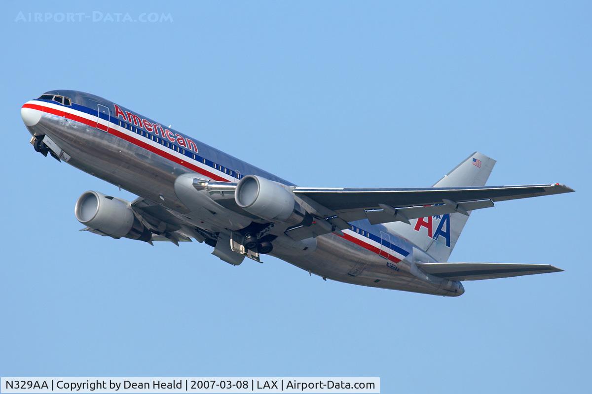 N329AA, 1987 Boeing 767-223 C/N 22329, Condensation briefly appears at the engine faces of American Airlines N329AA (FLT AAL22) as she climbs out from RWY 25R enroute to John F Kennedy Int'l (KJFK).