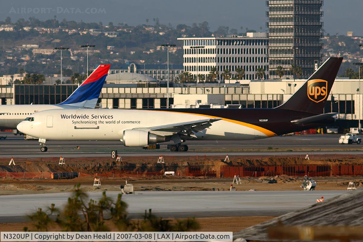 N320UP, 1997 Boeing 767-34AF C/N 27747, UPS N320UP (FLT UPS2920) exitting RWY 25R after arrival from Louisville Int'l Standiford Field (KSDF)