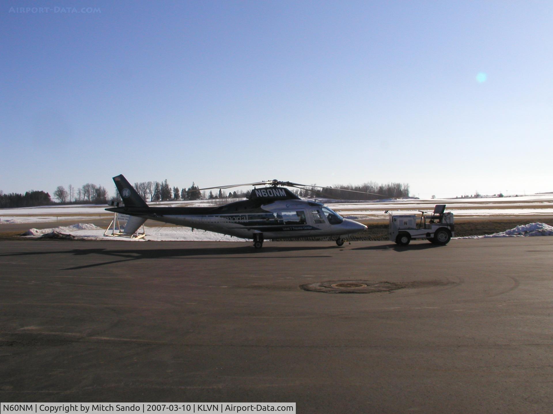 N60NM, 1995 Agusta A-109C C/N 7651, Air Care 1 as 60NM at Airlake hooked up to the North Memorial tug.