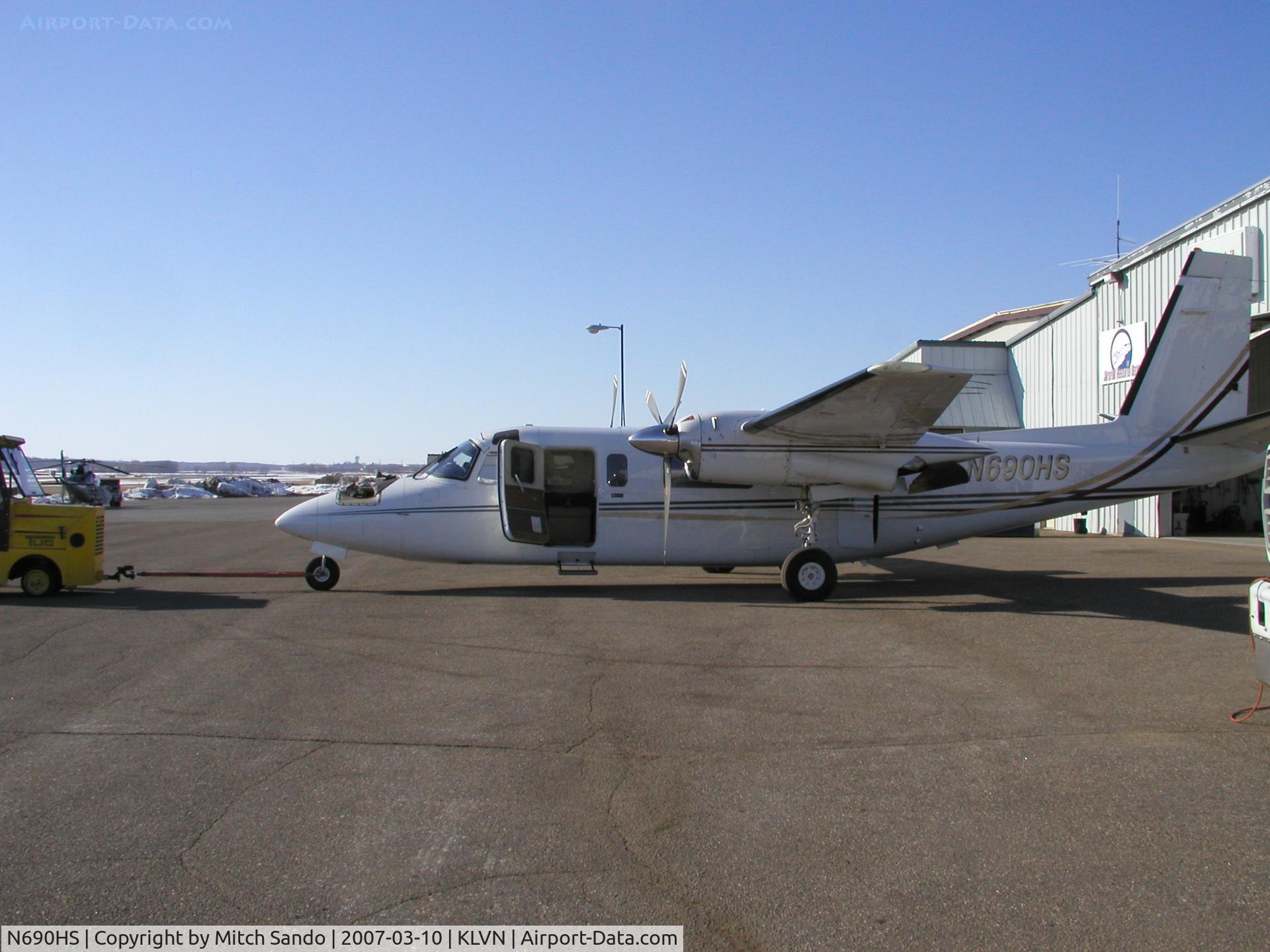 N690HS, 1978 Rockwell International 690B C/N 11431, This Turbo Commander is getting towed out of the maintenance hangar to run-up the engines.