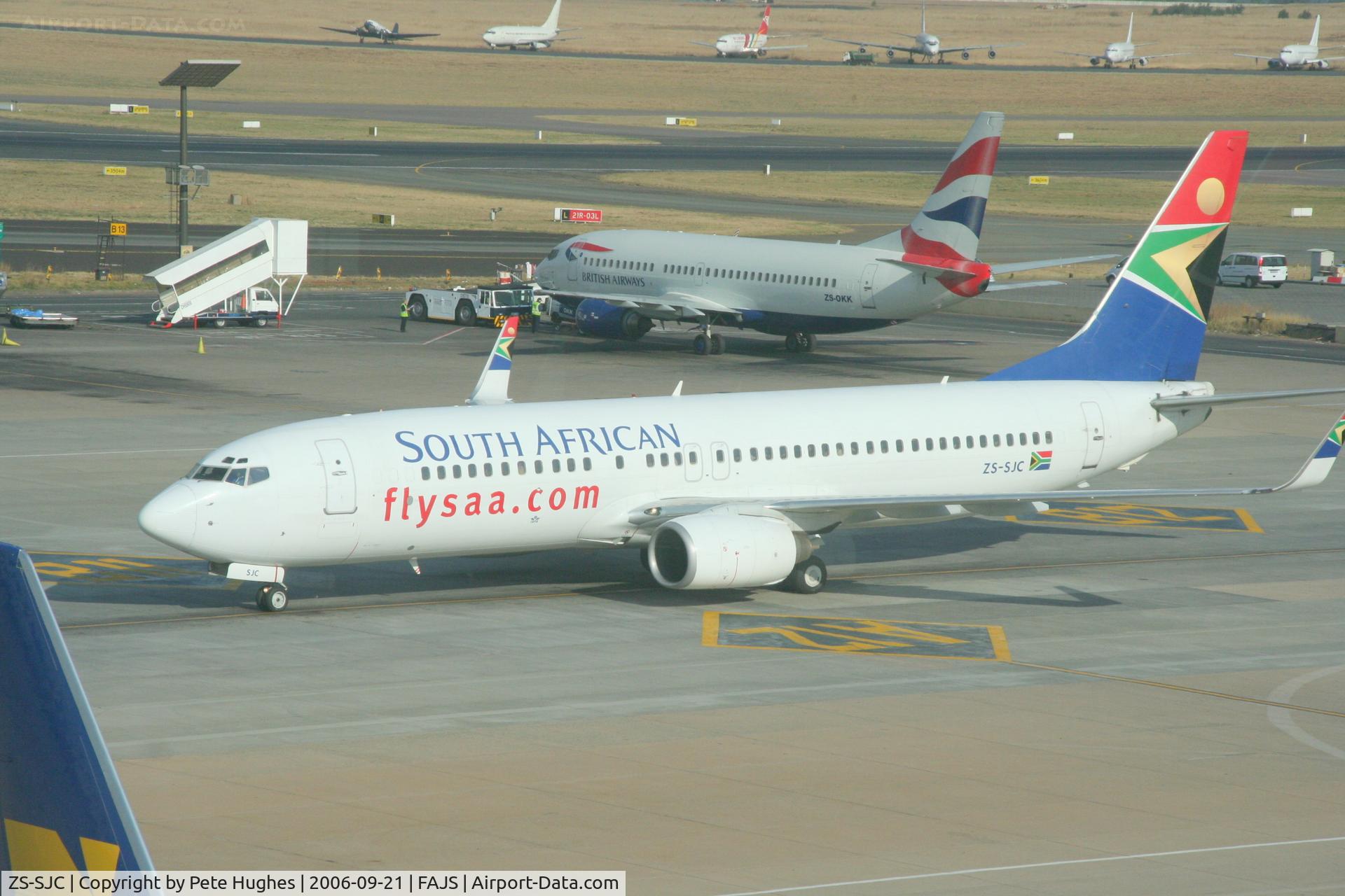 ZS-SJC, 2000 Boeing 737-85F C/N 28828, Johannesburg, South Africa, taken through terminal window