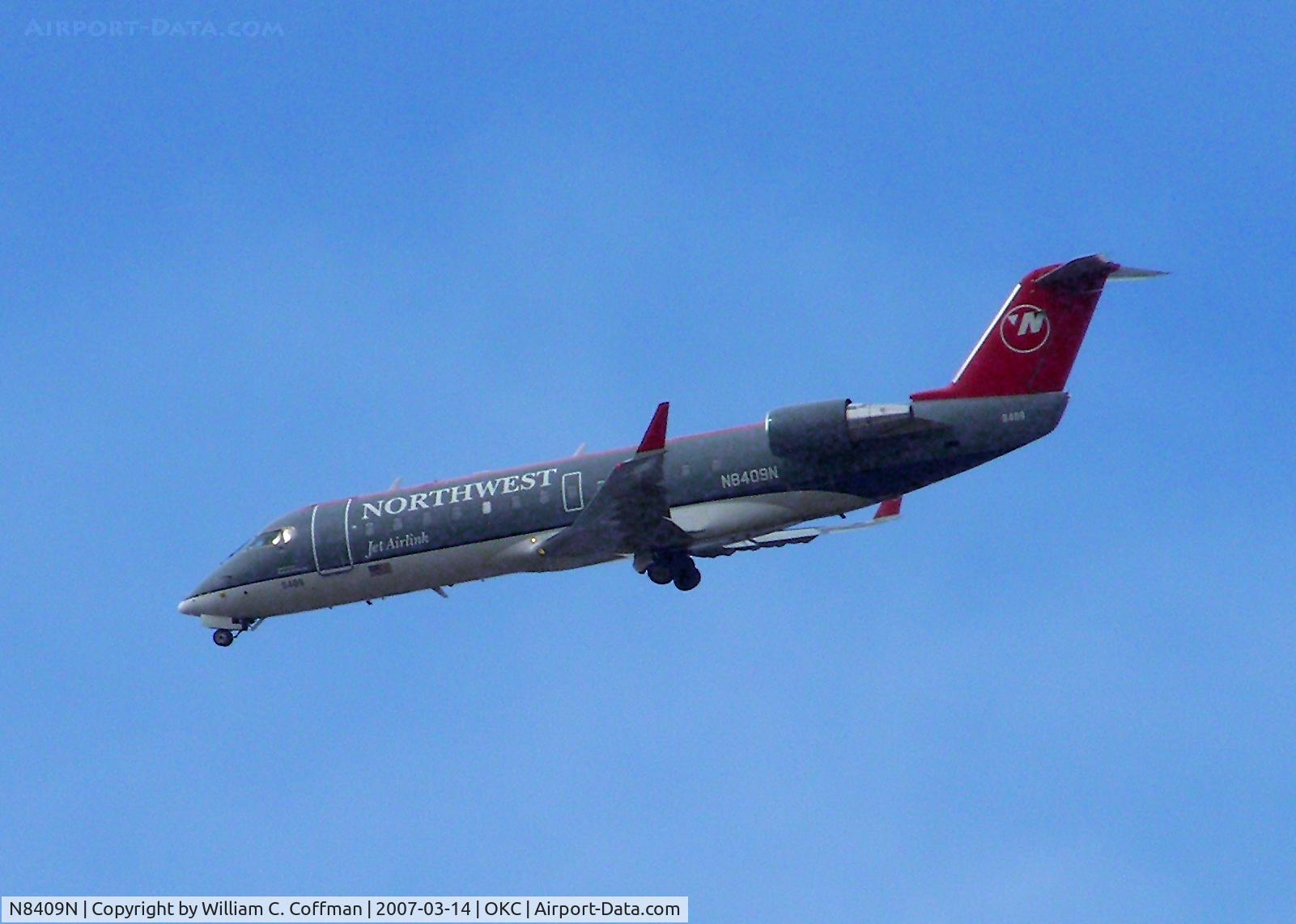 N8409N, 2000 Canadair CRJ-200LR (CL-600-2B19) C/N 7409, Flying over State Fairgrounds in Oklahoma City. Heading to Will Rogers