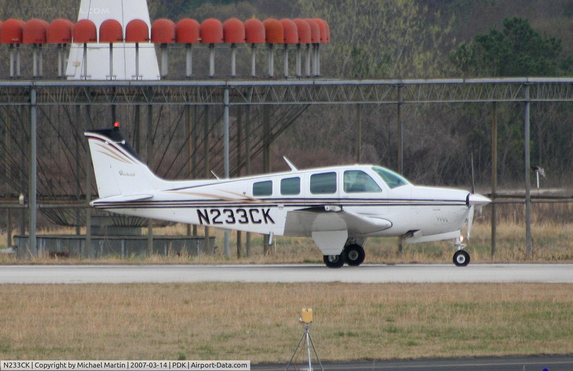 N233CK, 1977 Beech A36 Bonanza 36 C/N E-1014, Landing Runway 20L