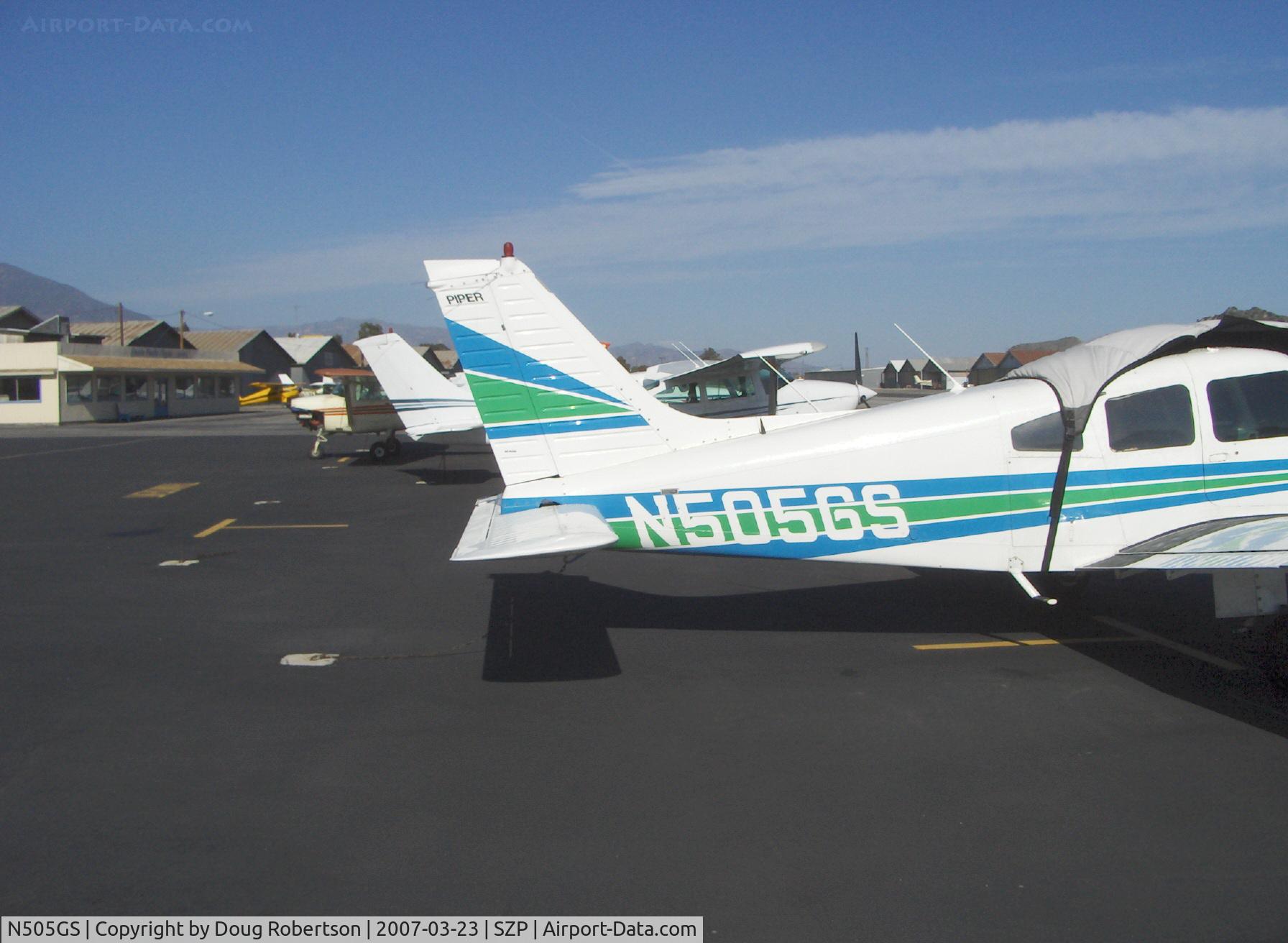 N505GS, 1977 Piper PA-28-181 C/N 28-7890275, 1971 Piper PA-28-181 ARCHER III, Lycoming O&VO-360 180 Hp, tail. (Aircraft cover dislodged by strong, gusty winds)