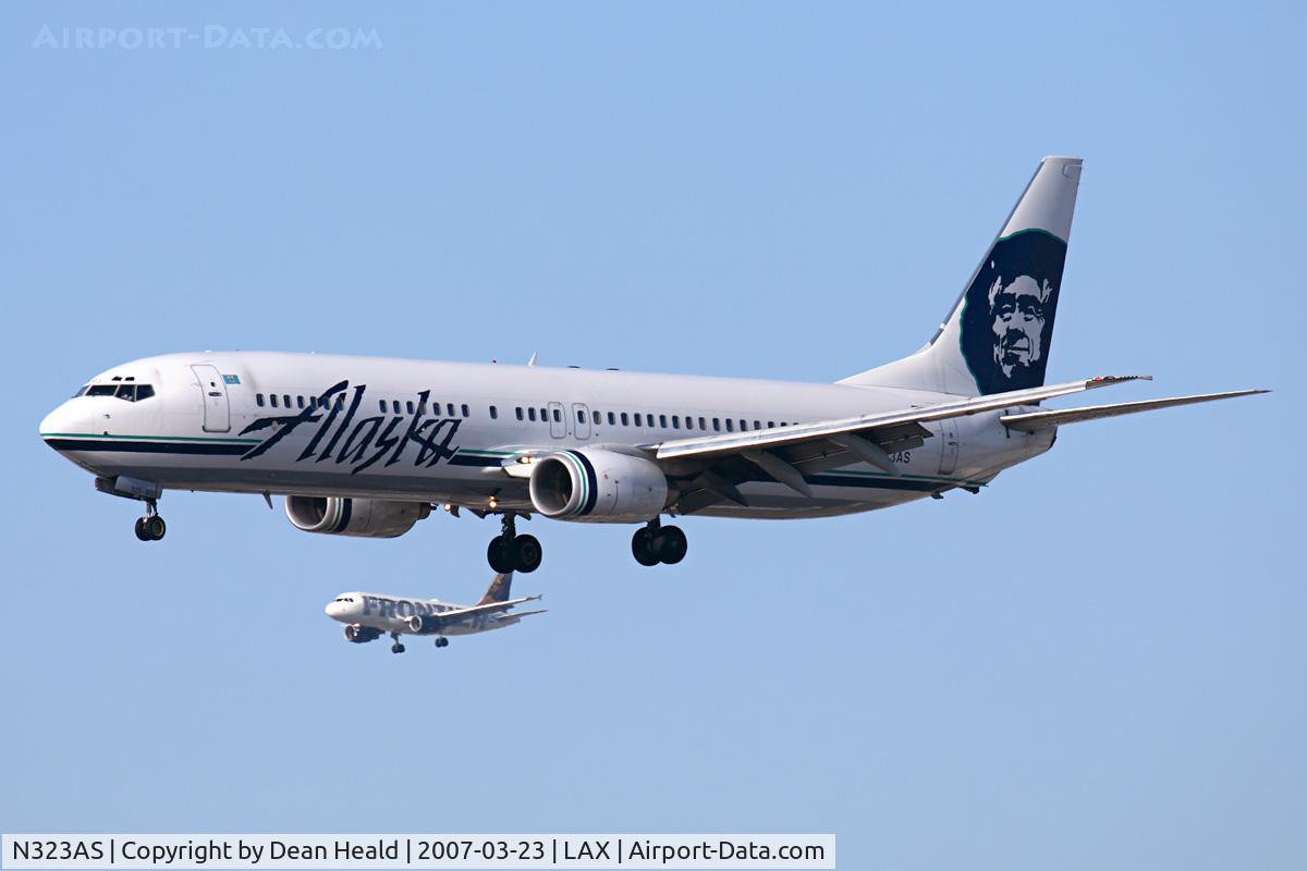 N323AS, 2004 Boeing 737-990 C/N 30021, Alaska Airlines N323AS (FLT ASA279) from Los Cabos Int'l (MMSD) on final approach to RWY 25R. The Frontier Airlines A319 is on final to RWY 24R.