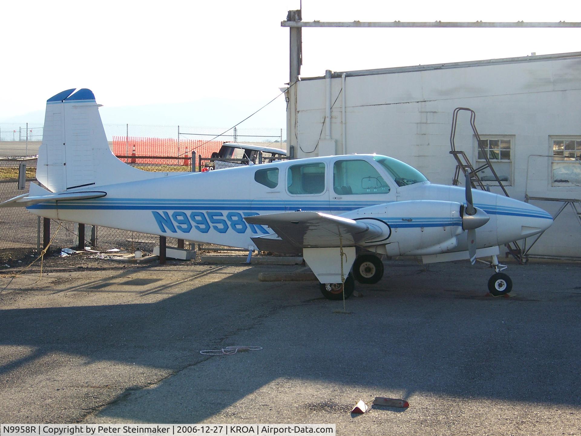 N9958R, 1960 Beech B95 Travel Air C/N TD-397, In for some maintenance.  It appears to be missing the right aileron.