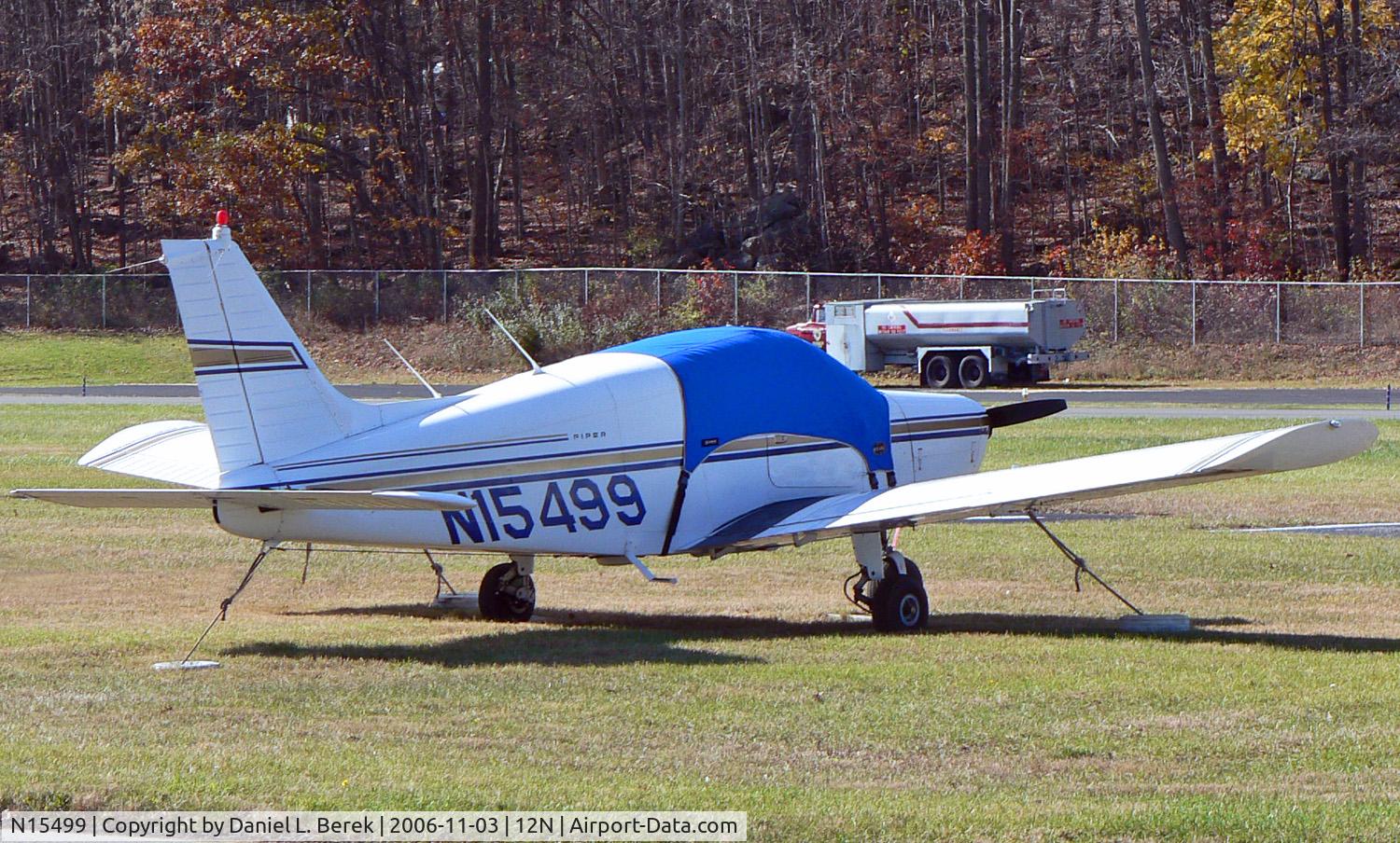 N15499, 1972 Piper PA-28-140 C/N 28-7325080, Elderly 1972 Cherokee 140 hides under a protective tarp at Aeroflex Andover.