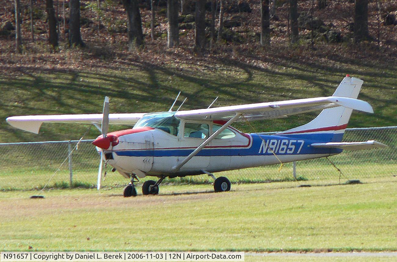 N91657, 1969 Cessna 182M Skylane C/N 18259858, Slightly modified Skylane sits on the hillside at Aeroflex Andover.