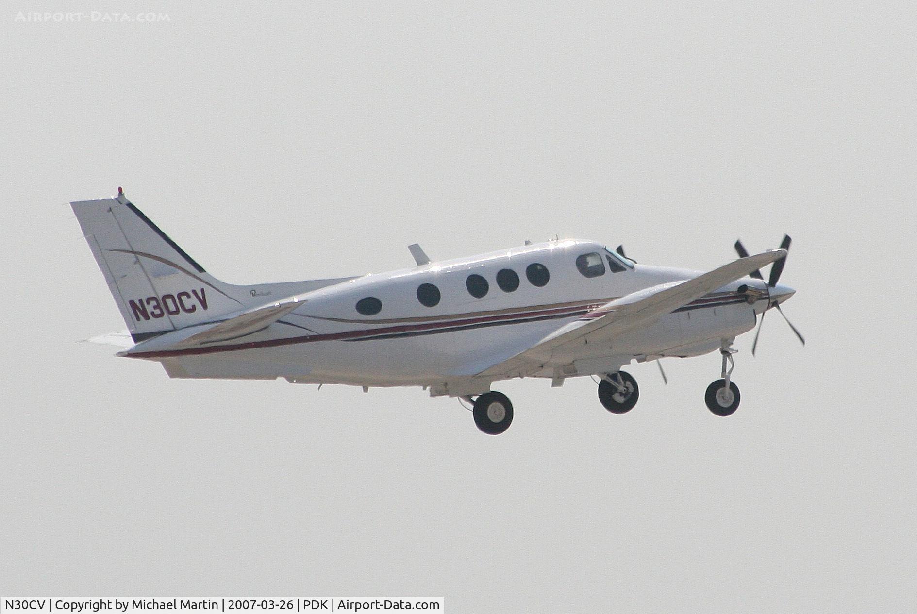 N30CV, 1977 Beech E-90 King Air C/N LW-252, Departing PDK enroute to X40