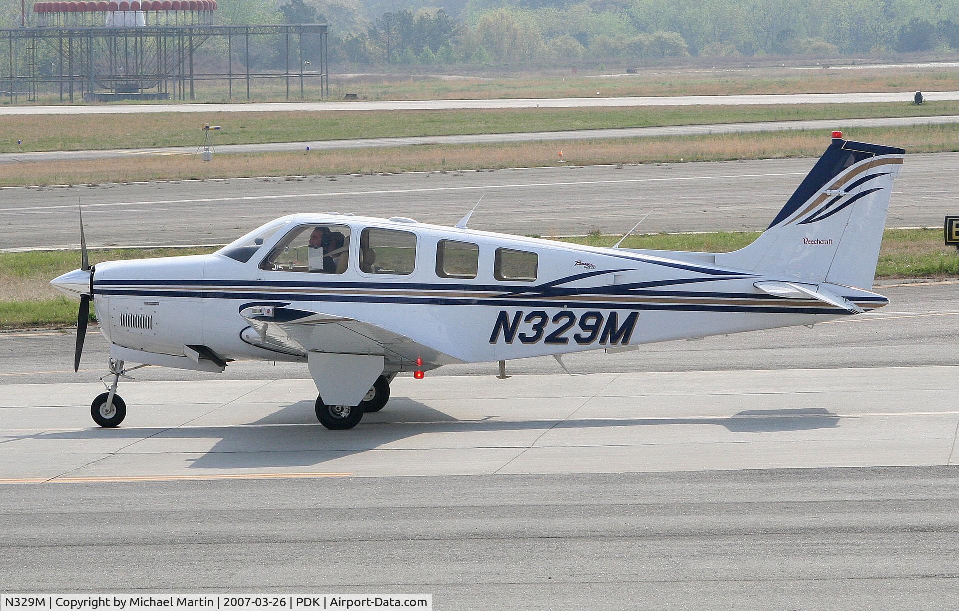 N329M, Raytheon Aircraft Company A36 Bonanza C/N E-3490, Taxing to Epps Air Service