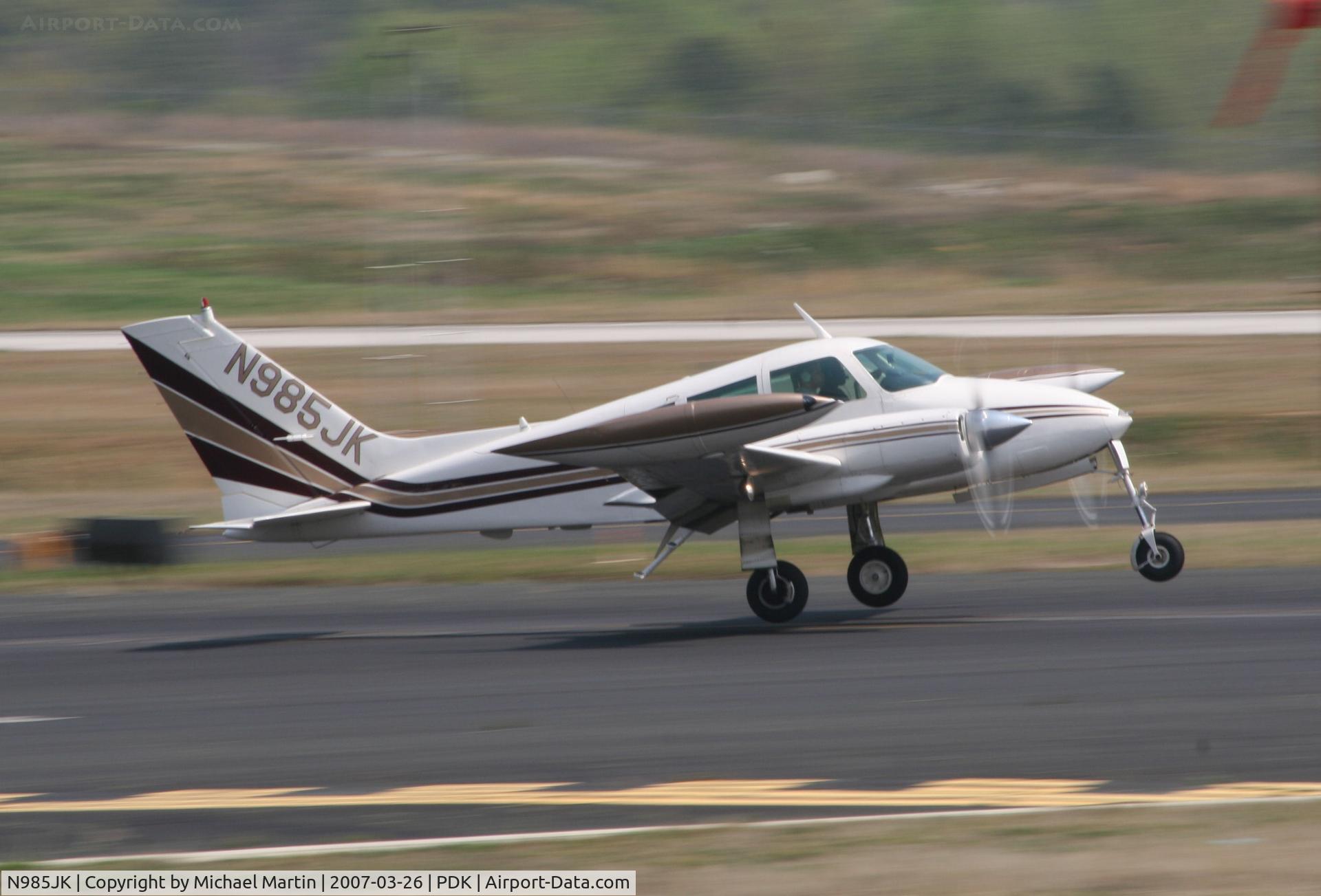 N985JK, 1964 Cessna 310I C/N 310I0012, Landing Runway 20R