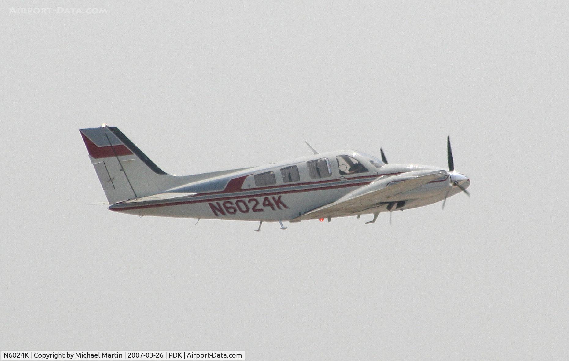 N6024K, 1979 Beech 58P Baron C/N TJ-187, Departing PDK enroute to HEF