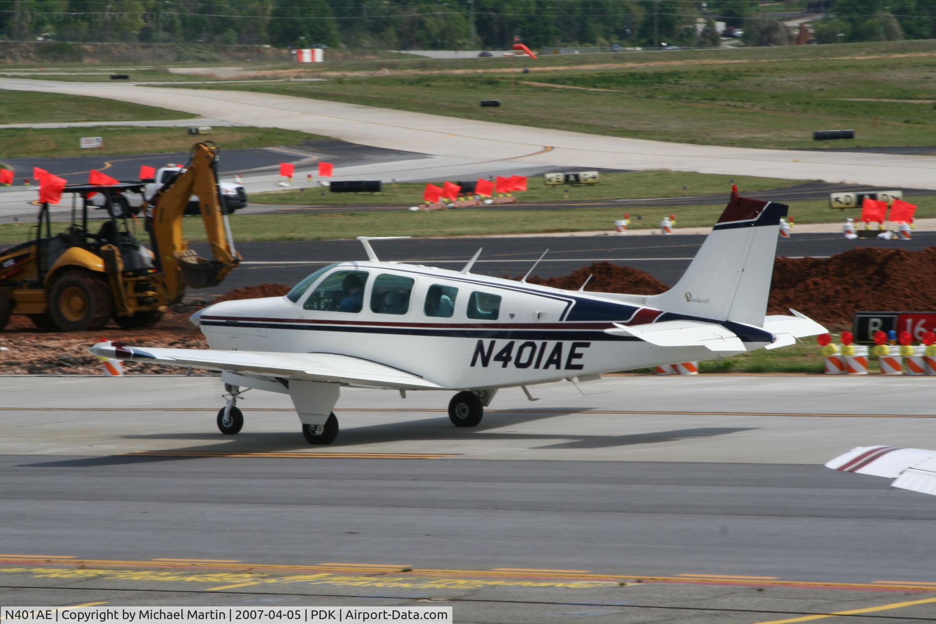 N401AE, 1976 Beech A36 Bonanza 36 C/N E865, Taxing past on going construction