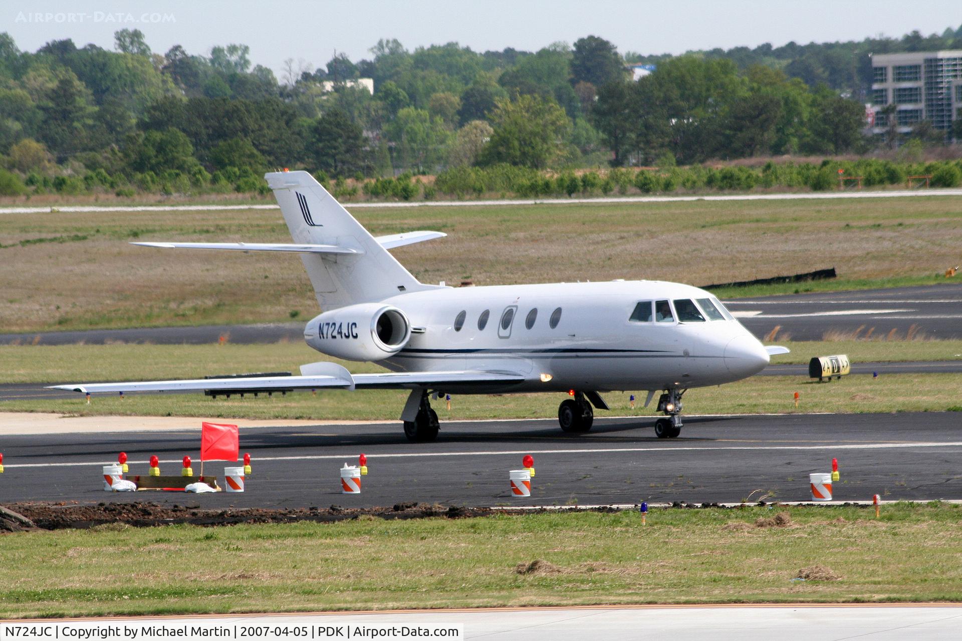 N724JC, 1974 Dassault Fan Jet Falcon (20E-5) C/N 310, Taxing past on going construction