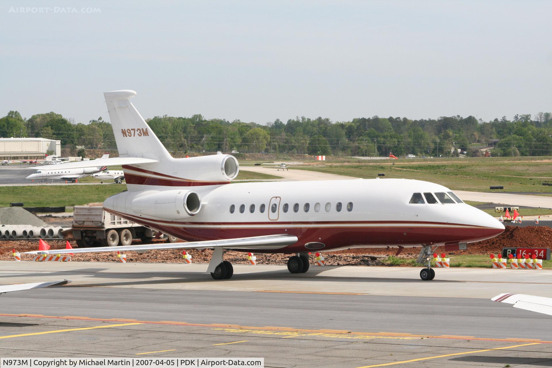 N973M, 2000 Dassault Falcon 900EX C/N 73, Taxing past on going construction