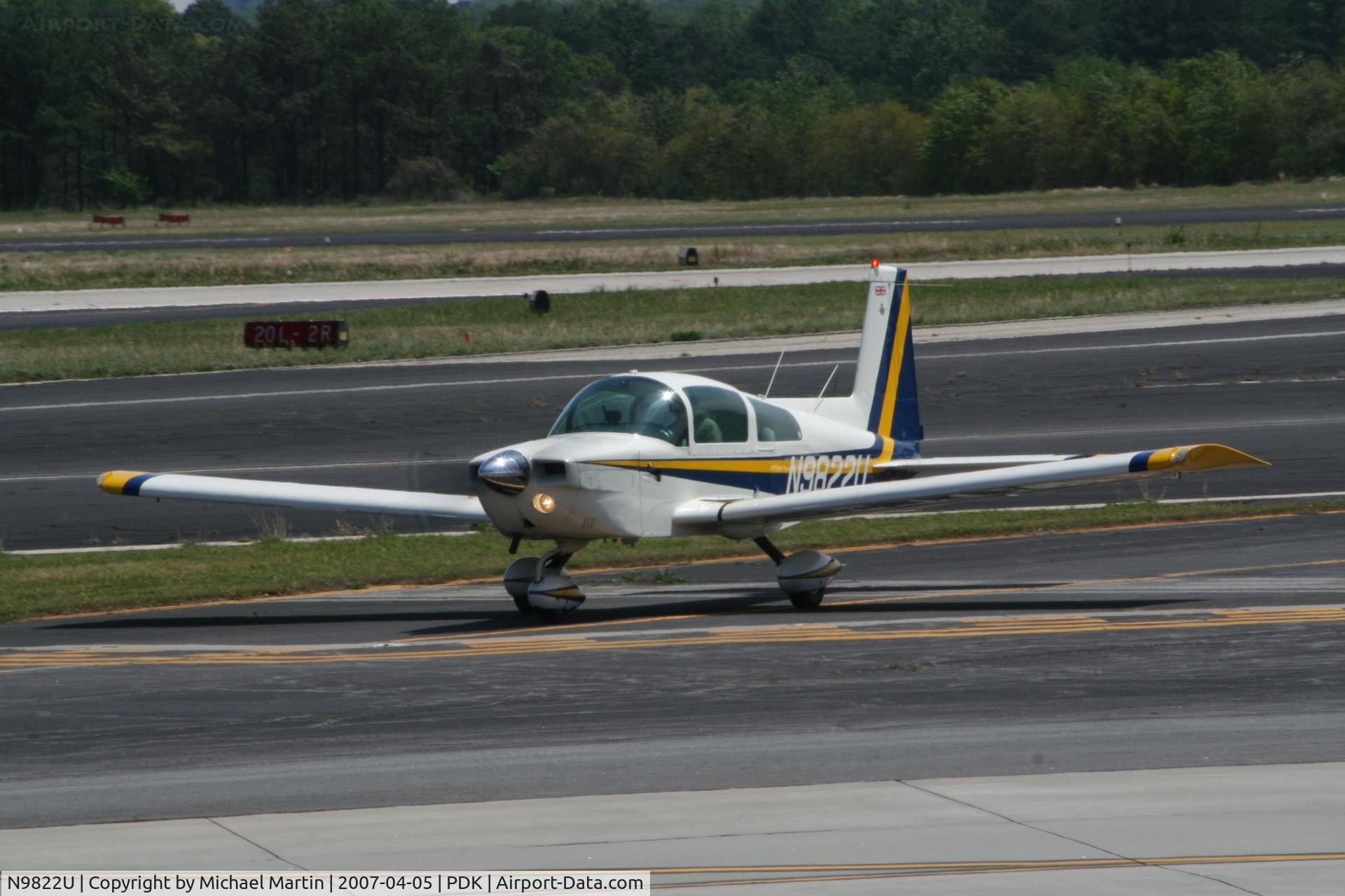 N9822U, 1976 Grumman American AA-5A Cheetah C/N AA5A0222, Taxing to Mercury Air Center