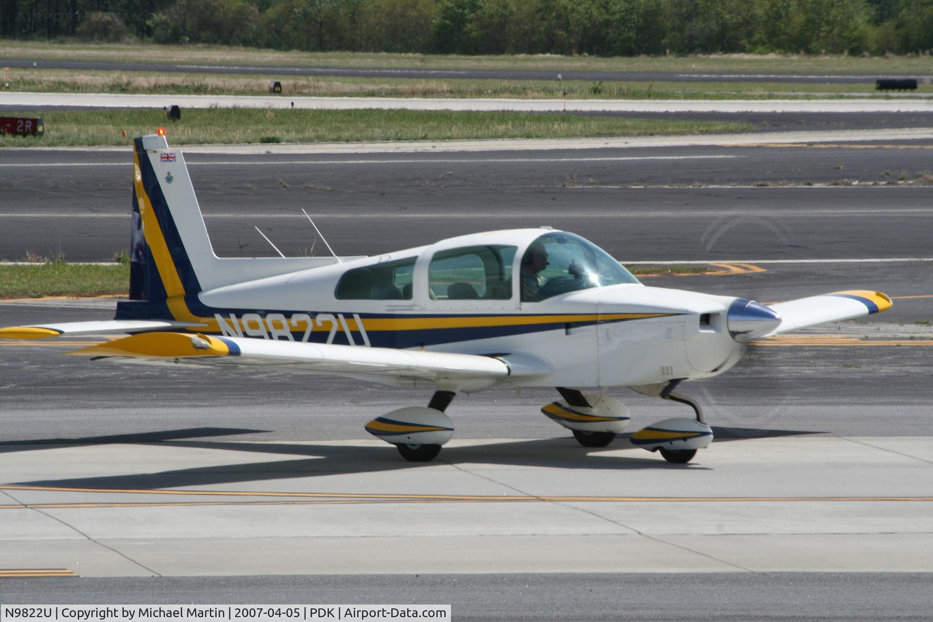 N9822U, 1976 Grumman American AA-5A Cheetah C/N AA5A0222, Taxing to Mercury Air Center