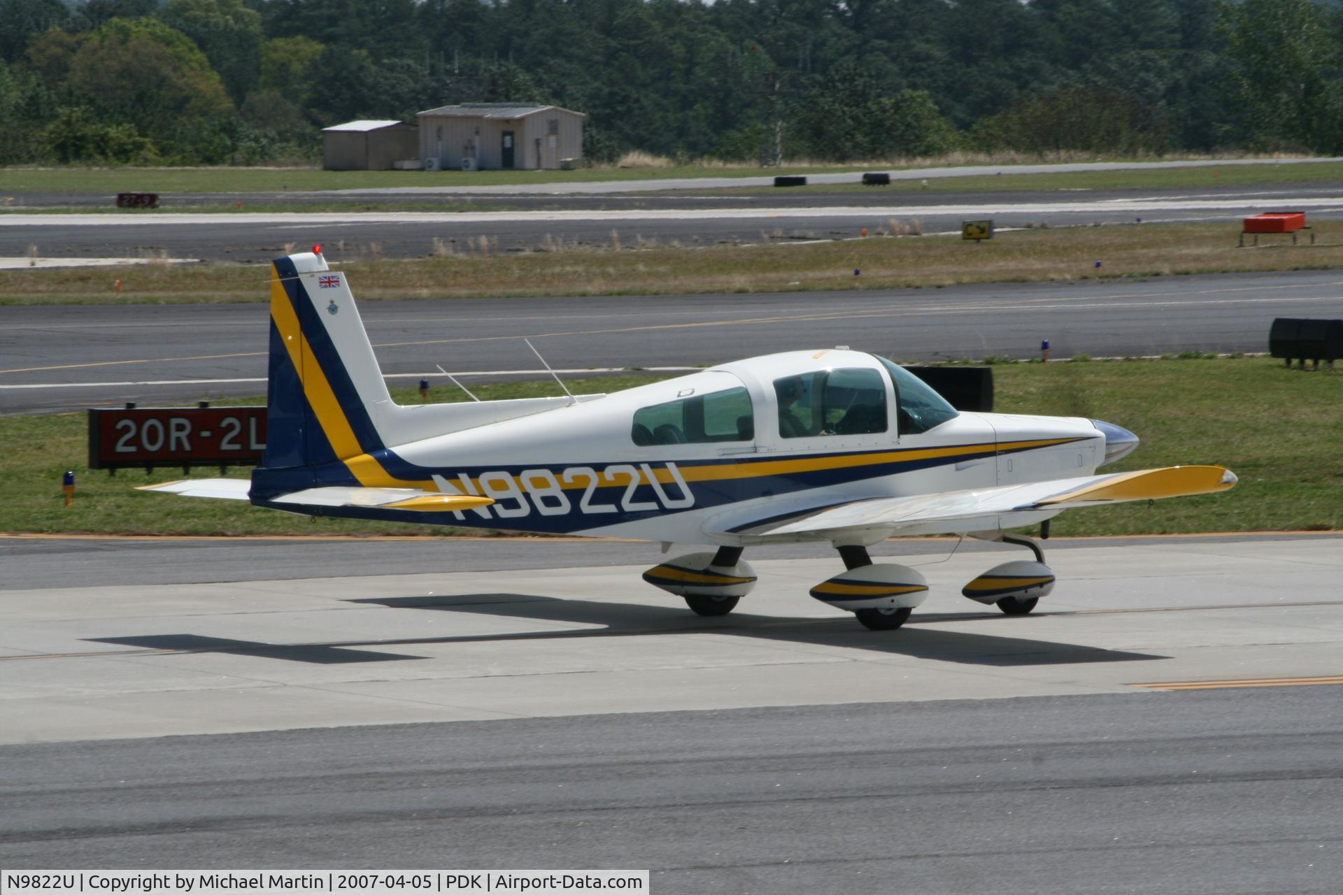 N9822U, 1976 Grumman American AA-5A Cheetah C/N AA5A0222, Taxing to Mercury Air Center