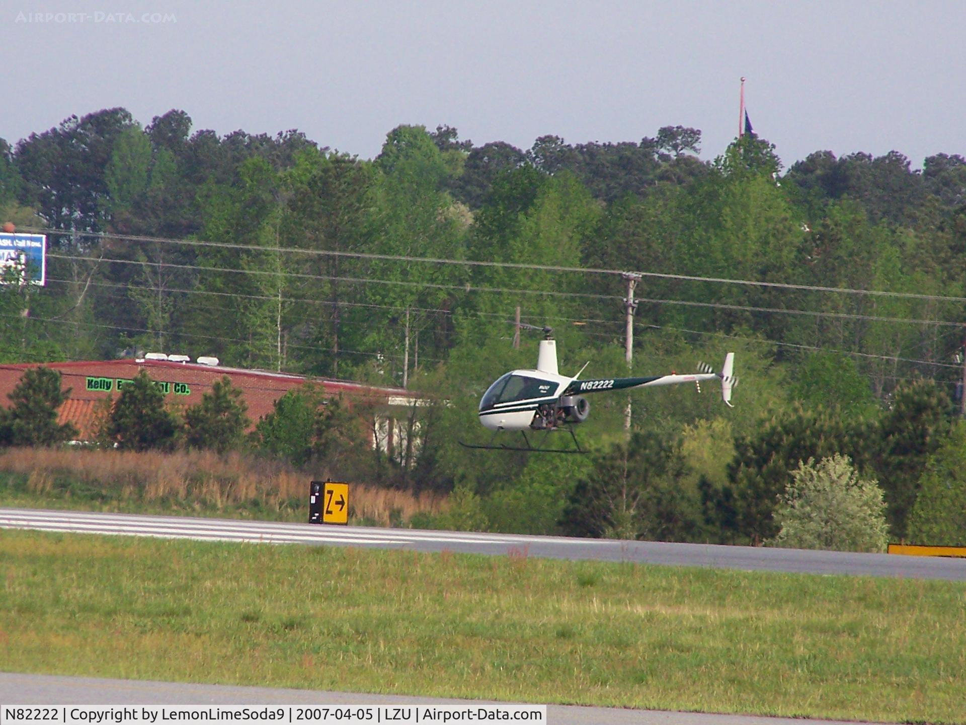 N82222, 1988 Robinson R22 BETA C/N 0847, This was shot from across the feild.