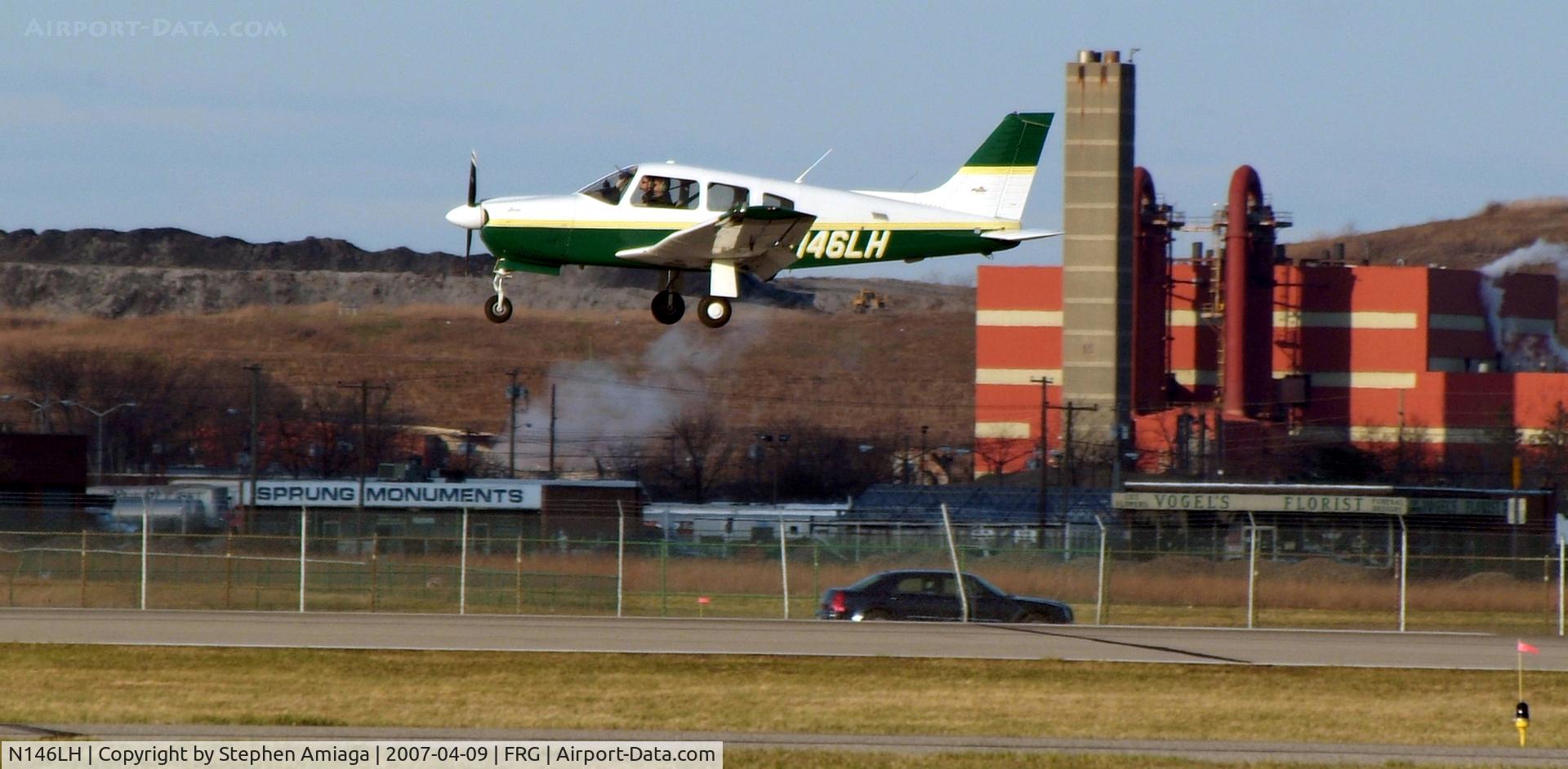 N146LH, 2003 Piper PA-28R-201 Cherokee Arrow III C/N 2844102, Farmingdale State Arrow about to touch down
