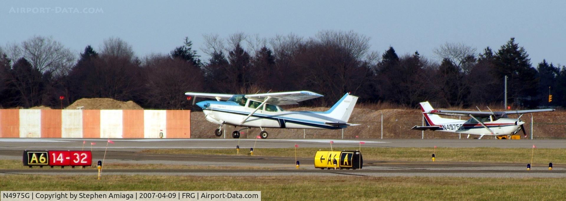 N4975G, 1979 Cessna 172N C/N 17273522, Skyhawk waiting behind a departing skyhawk...