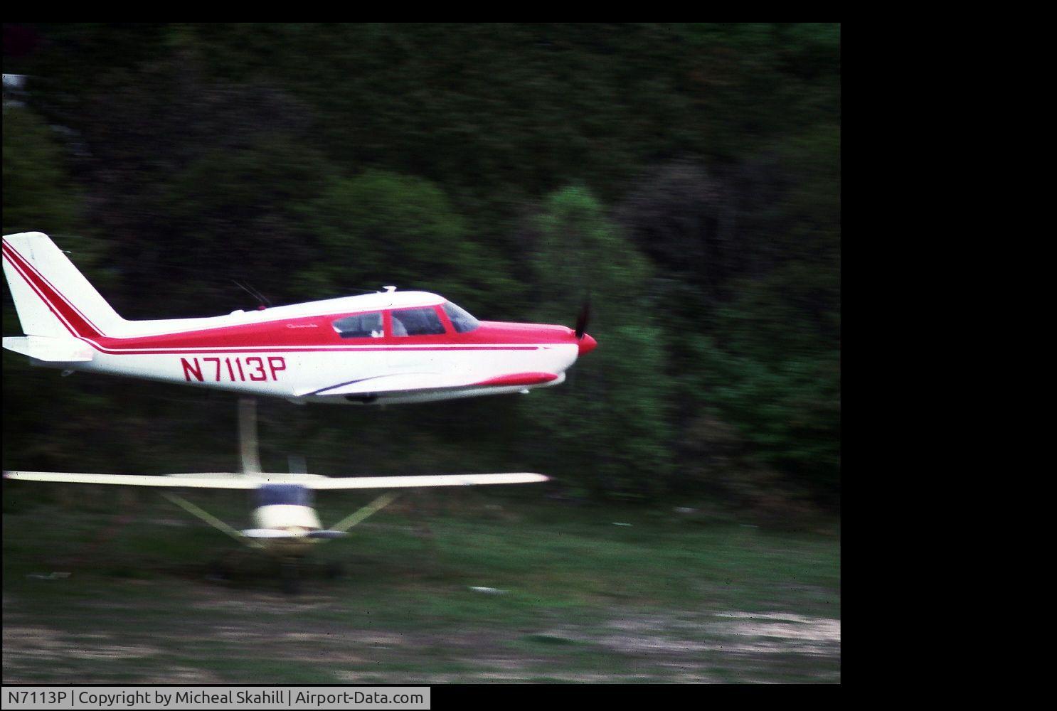 N7113P, 1960 Piper PA-24 Comanche C/N 24-1879, FLyby @ Edwards Airport long Island NY June 1975 (Airport no longer in use)