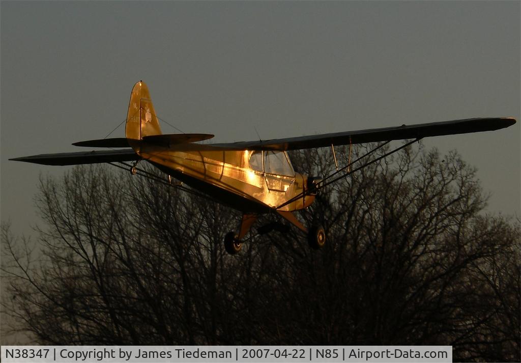 N38347, 1941 Piper J3C-65 Cub C/N 6955, This Cub glides down on to runway two-six on a glorious April evening.
