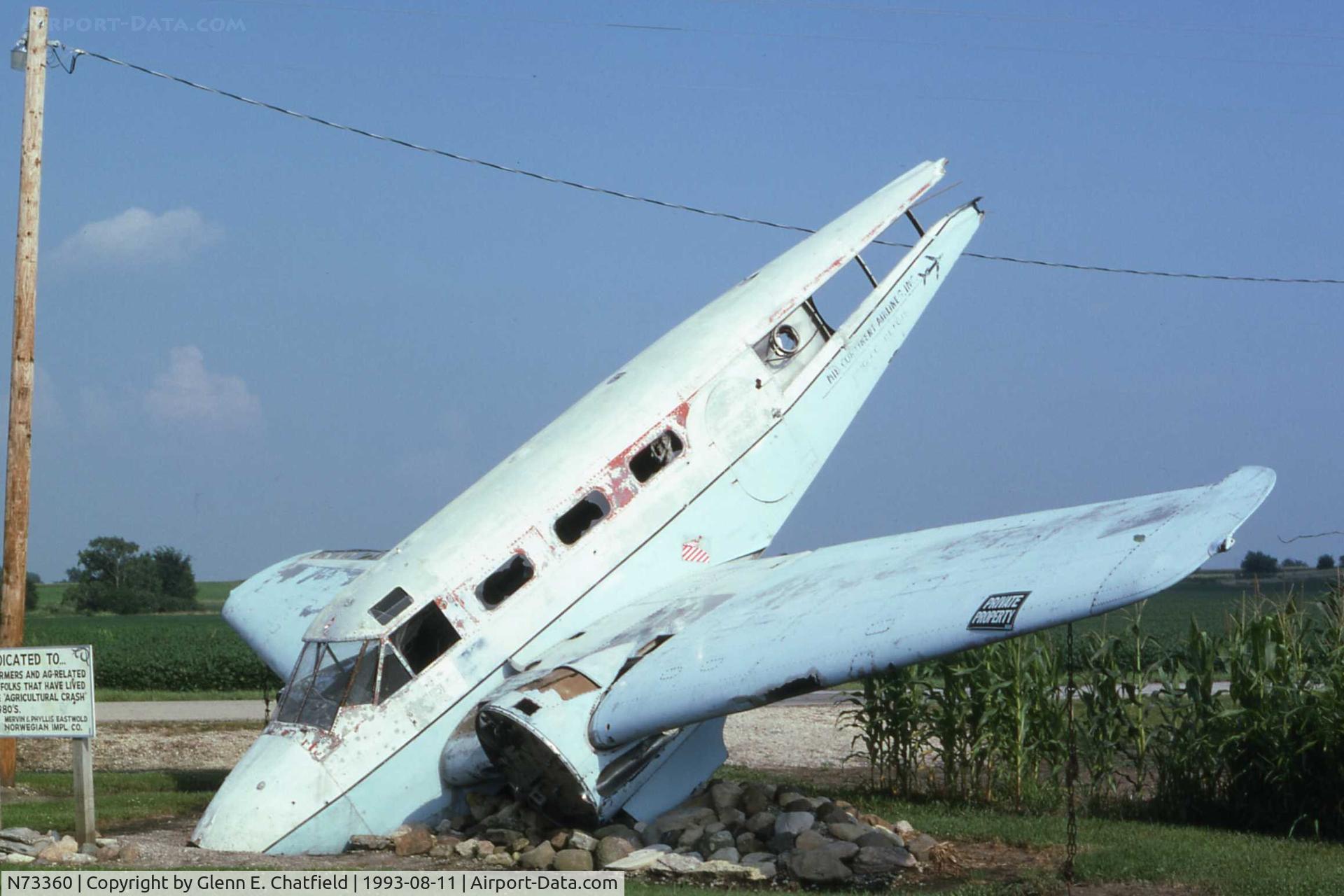 N73360, 1942 Beechcraft AT-11 C/N 1296, AT-11 41-27451.On Illinois SR71 SW of Norway.  Memorial to the agricultural crash tailplane of C-45H 51-11904 added in 2001.