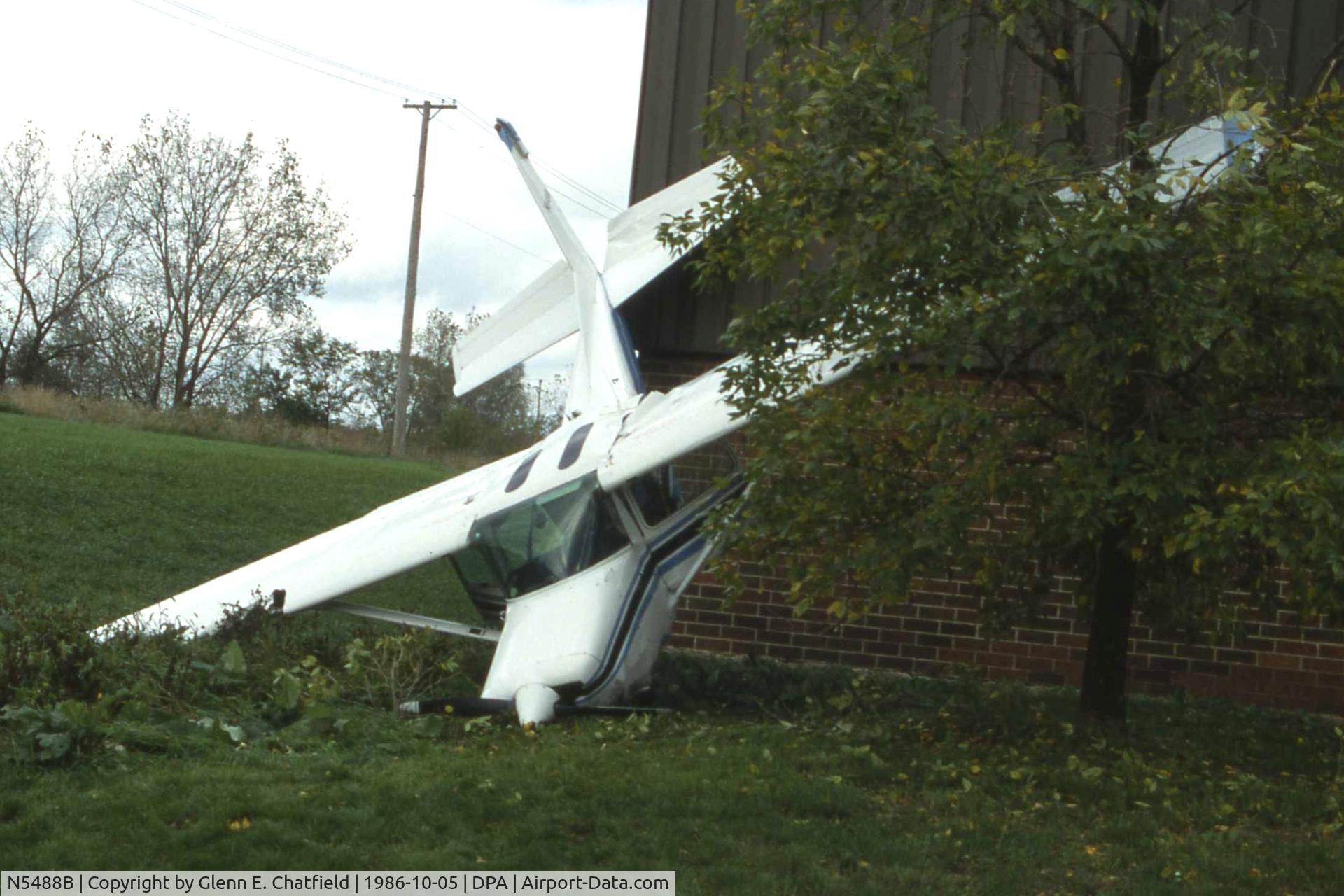 N5488B, Cessna 152 C/N 15283883, Out of fuel, landed on roof and went over the side.  About 3/4 mile final from Runway 33