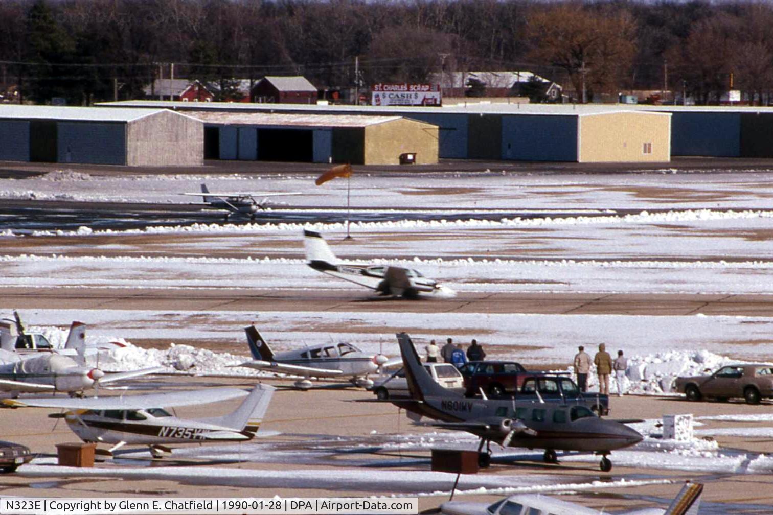 N323E, 1963 Beech 95-A55 Baron C/N TC-421, Gear stuck in transit, landing runway 15 with fire trucks standing by.  Good job.