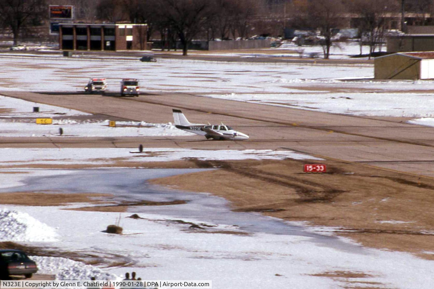 N323E, 1963 Beech 95-A55 Baron C/N TC-421, Gear stuck in transit, landing runway 15 with fire trucks standing by.  Good job.
