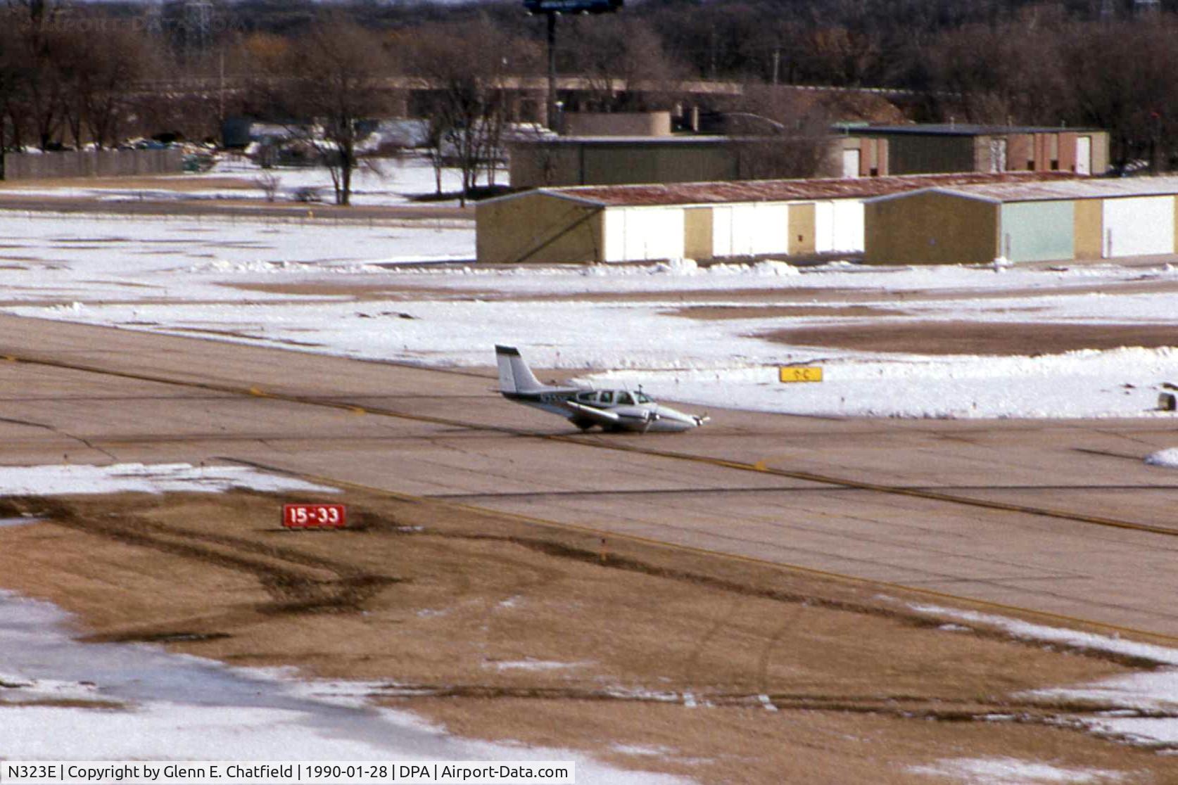 N323E, 1963 Beech 95-A55 Baron C/N TC-421, Gear stuck in transit, landing runway 15 with fire trucks standing by.  Good job.