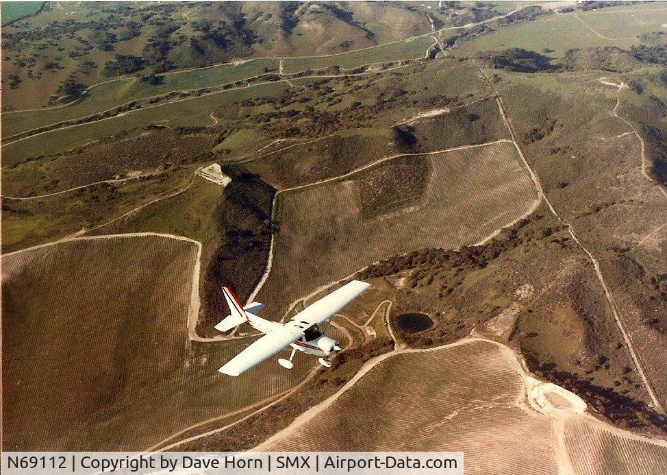 N69112, 1978 Cessna 152 C/N 15282489, Over the fields between Santa Maria and Guadelupe.