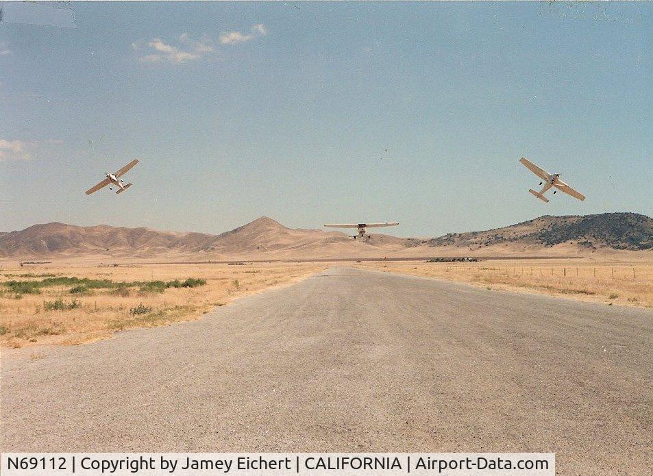 N69112, 1978 Cessna 152 C/N 15282489, I'm pretty sure that is 112 on the left. I was flying N6592B on the right. Mike Williams was in N6883F in the middle if I remember right.