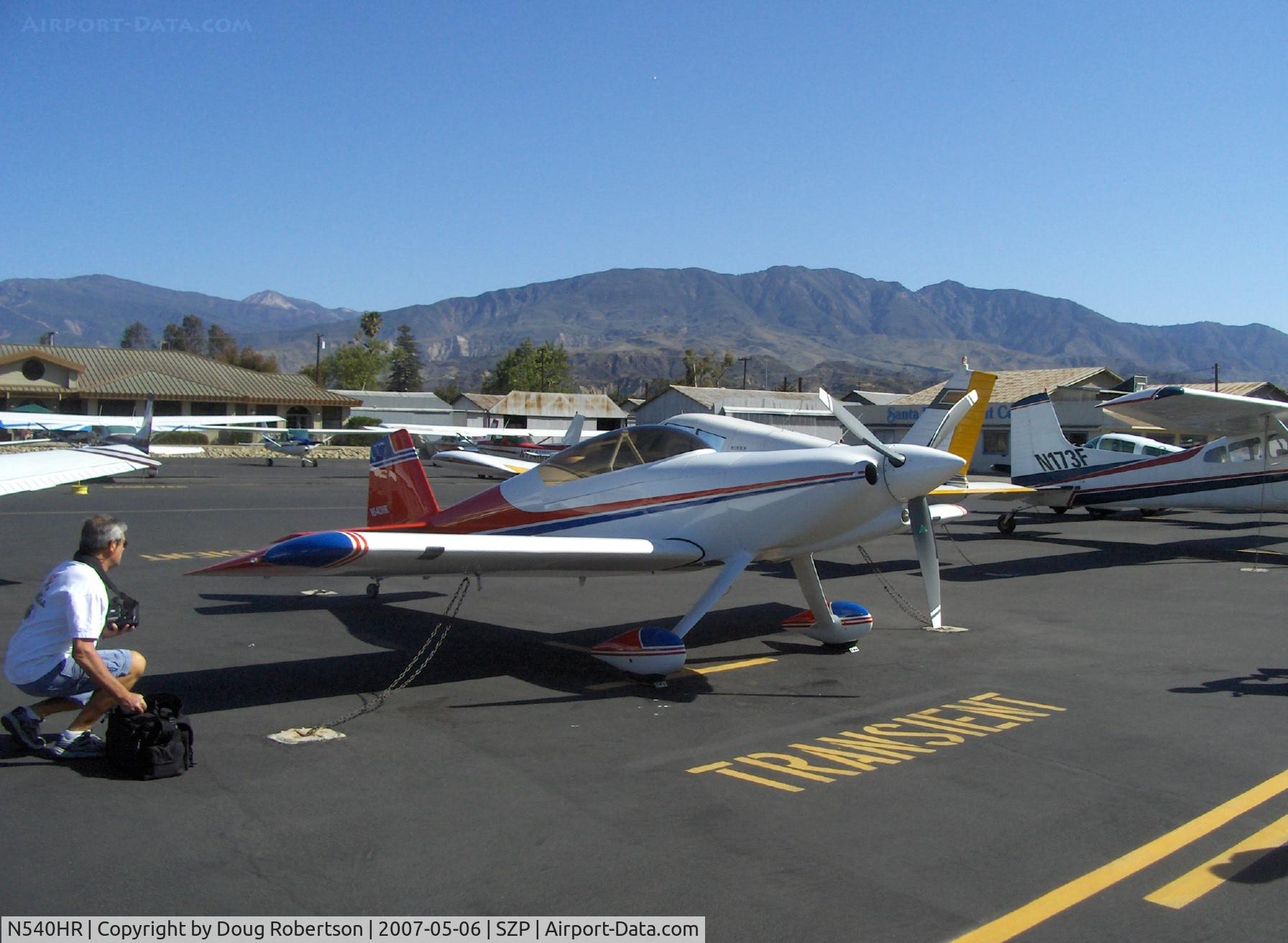 N540HR, 2002 Vans RV-4 C/N 0002, 2002 Howe HARMON ROCKET Ser.#002, Lycoming IO-540 250 Hp, three blade MT scimitar prop, pro photographer setting up lens for shots