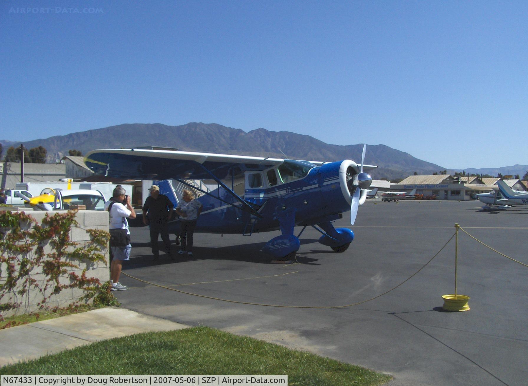 N67433, 1942 Howard Aircraft DGA-15P C/N 563, 1942 Howard DGA-15P, P&W R-985 Wasp Jr. 450 Hp, Archibald 'B', formerly based SZP, refueling, pro photographer gets a shot
