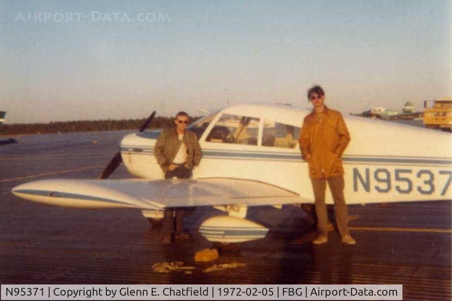 N95371, 1969 Piper PA-28-140 C/N PA28-25903, No longer registered.  One of my early flights, with a 6-month old license, taking these 2 friends flying.  Notice the ramp; our battalion built that from M8A1.