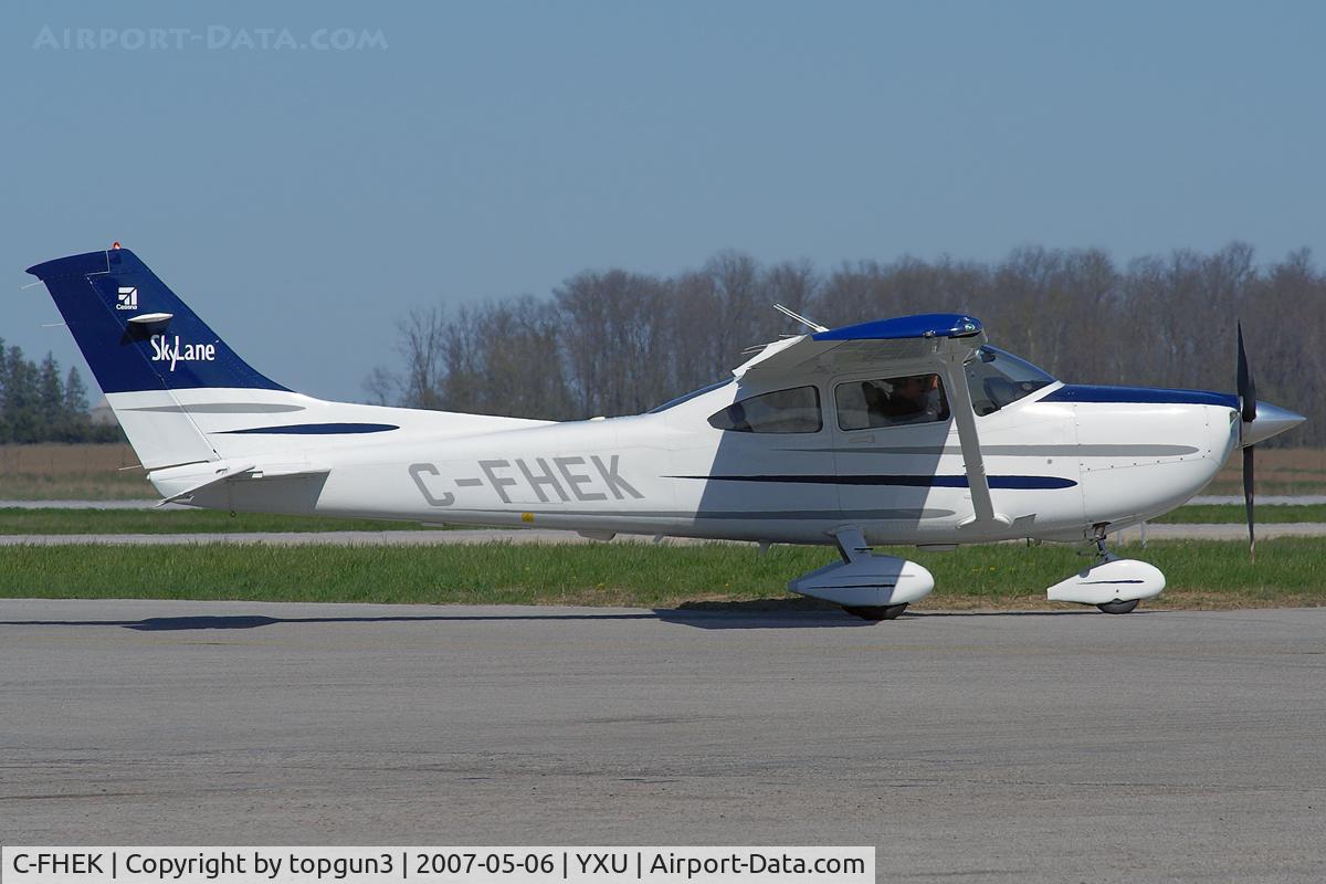 C-FHEK, 2003 Cessna 182T Skylane C/N 18281226, Taxiing on to Ramp III from Alpha.