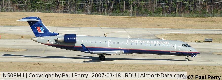 N508MJ, 2003 Bombardier CRJ-700 (CL-600-2C10) Regional Jet C/N 10087, Taxiing by the GA ramp, headed to her spot on RWY 23R