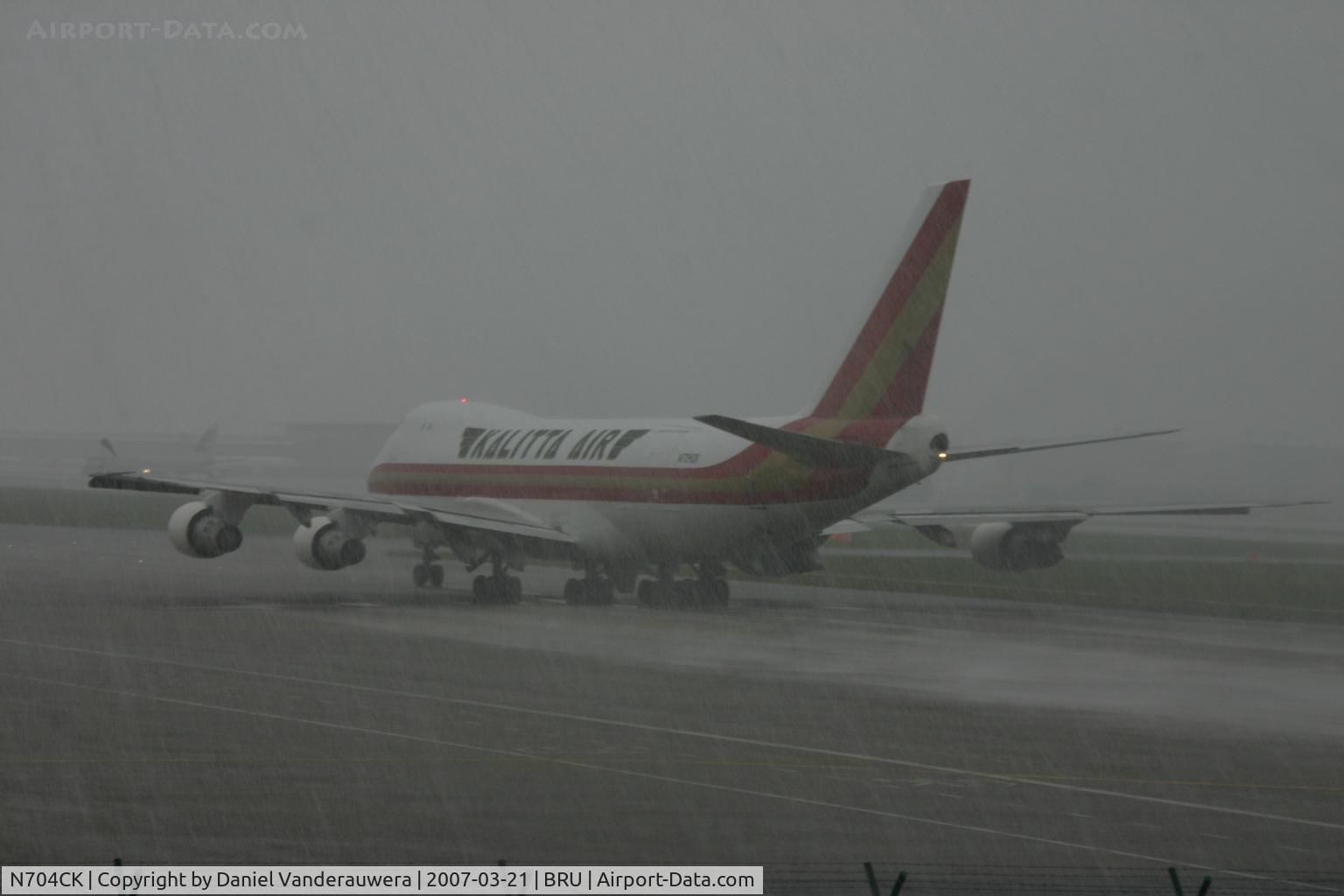 N704CK, 1980 Boeing 747-209F C/N 22299, departing under hail storm