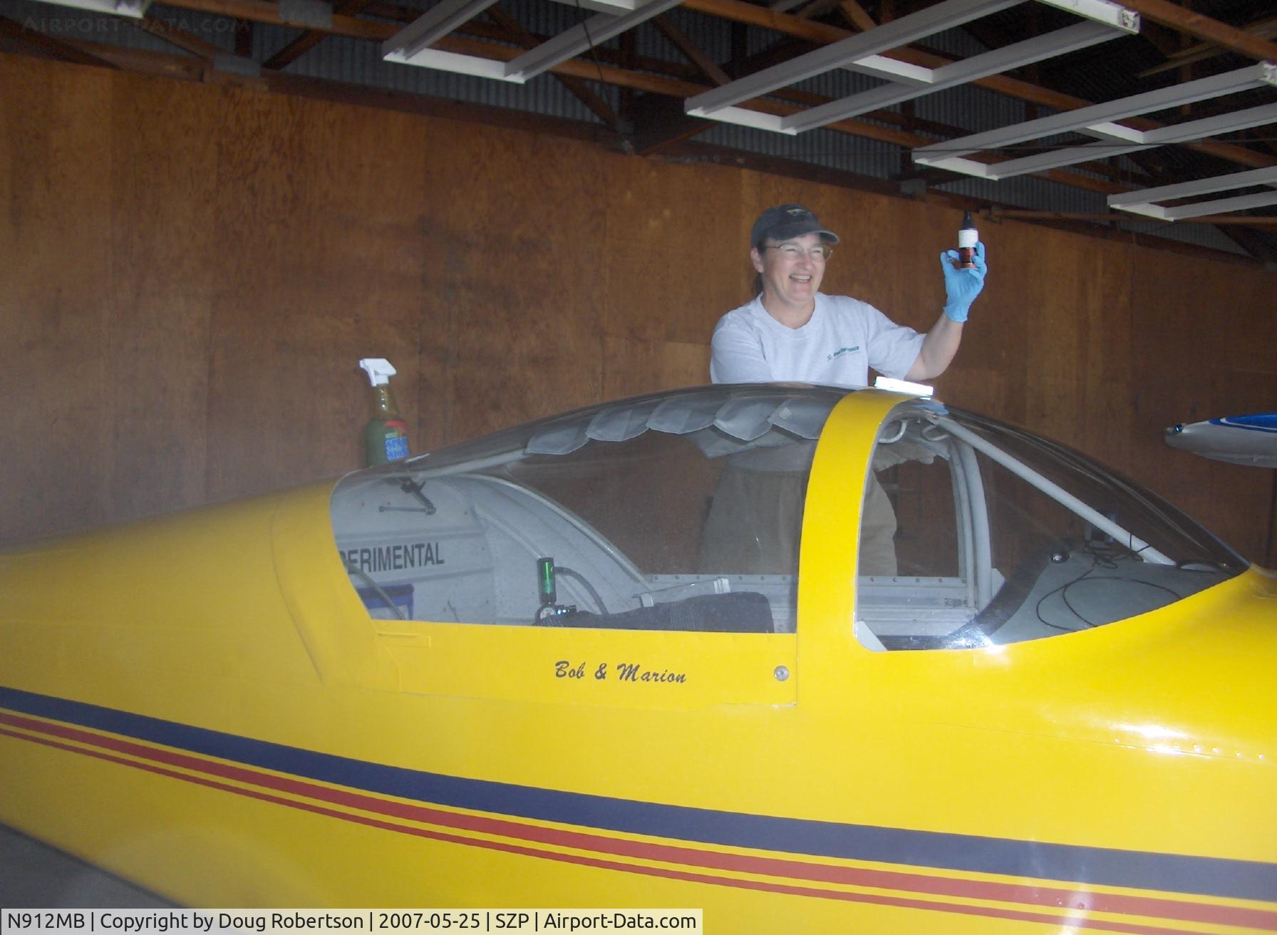 N912MB, 2004 Vans RV-9A C/N 90112, 2004 Nauman VAN's RV-9A, Lycoming O-320 160 Hp, pilot/builder Marion polishing canopy
